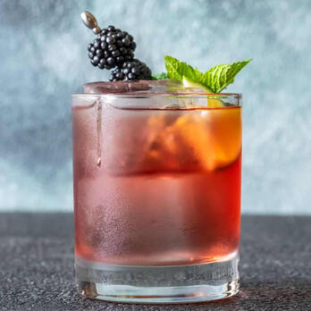 A seductive dance of bourbon and simple syrup, nuanced by aromatic bitters, and uplifted with a whisper of galago mint.