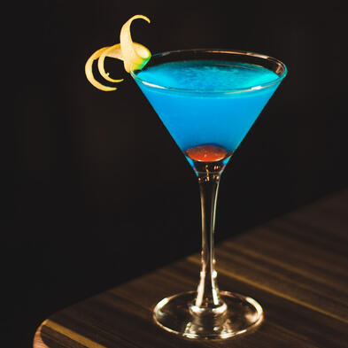 A mesmerizing blend of blue curaçao, zesty lemonette vodka, and the sweet allure of harcot schnapps.